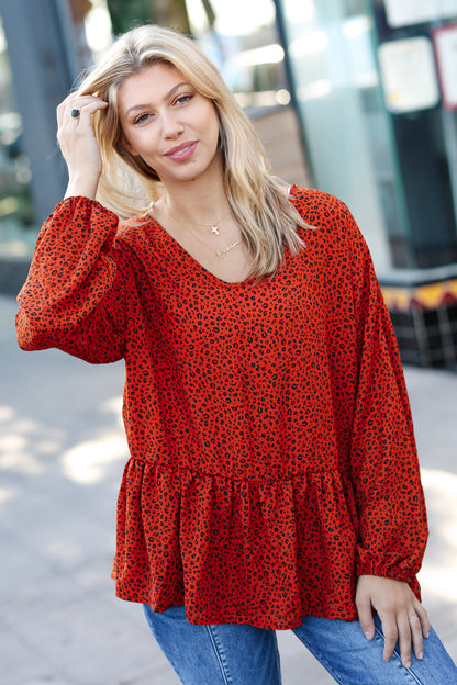 Feeling Bold Rust Leopard Print V Neck Peplum Top