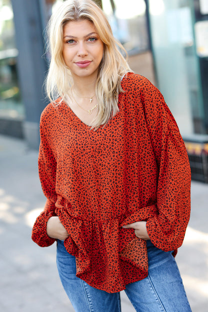 Feeling Bold Rust Leopard Print V Neck Peplum Top