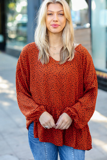 Feeling Bold Rust Leopard Print V Neck Peplum Top